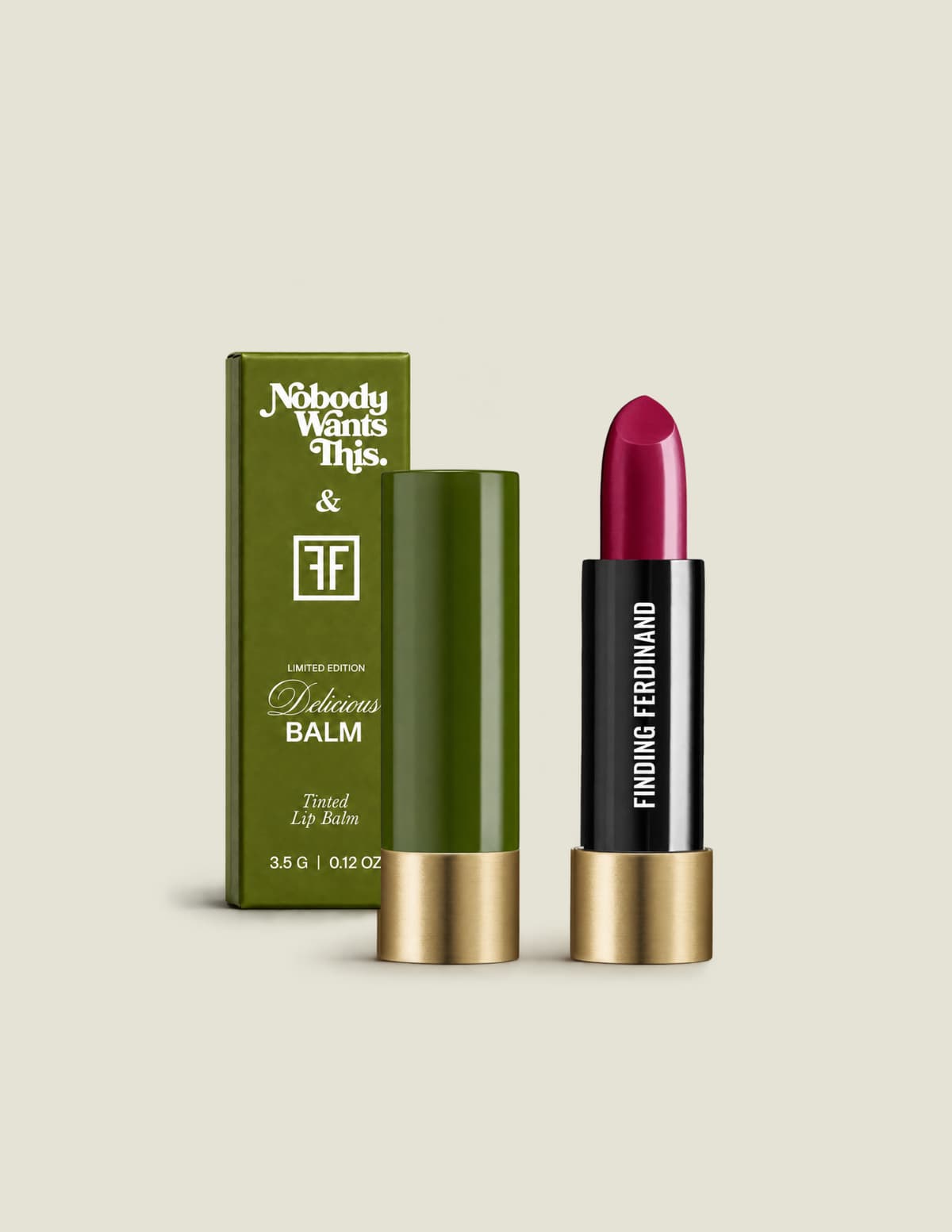 Shiksa balm in glossy berry fuchsia with black and gold tube, olive green cap and matching limited-edition box