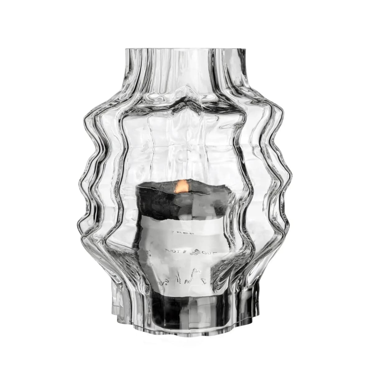 Clear wavy glass hurricane with a lit black Byredo candle distorted inside, on white