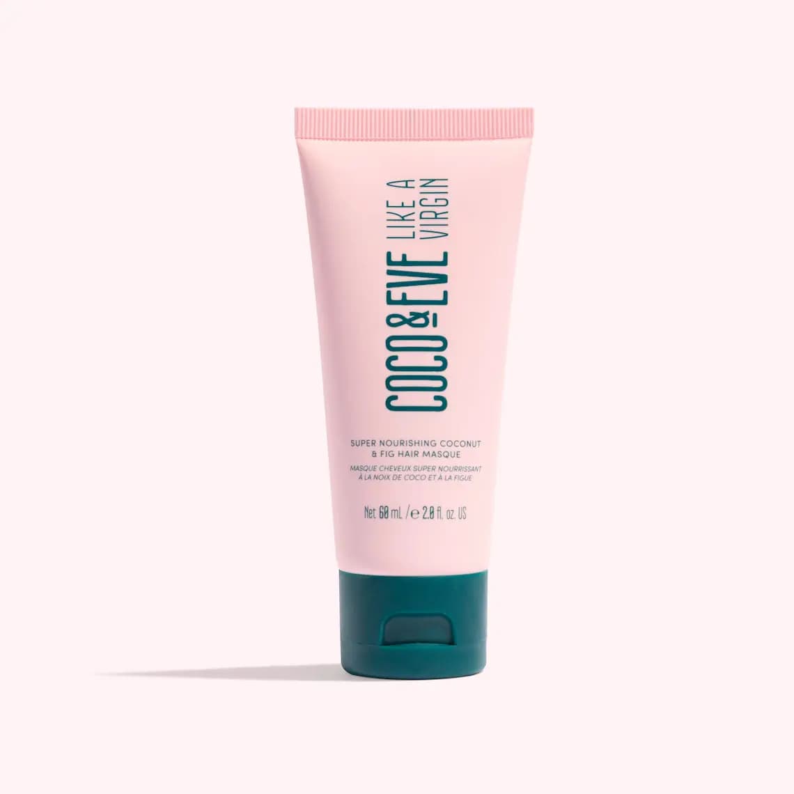 Coco & Eve Like A Virgin Super Nourishing Coconut & Fig Hair Masque in its 60ml pink travel tube with teal cap.