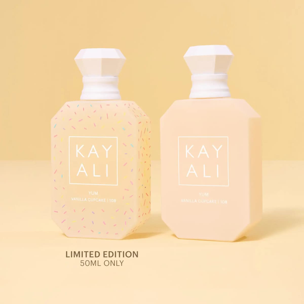 Sprinkle-print Limited Edition 50ml bottle beside the plain cream bottle on a pale yellow backdrop