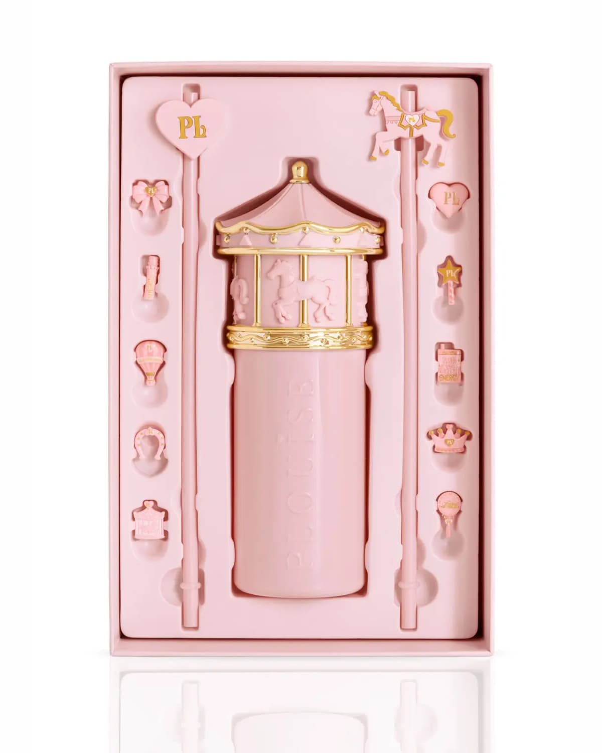 Once Upon A Sip pink carousel cup with gold carousel lid, straw and charms in its presentation box