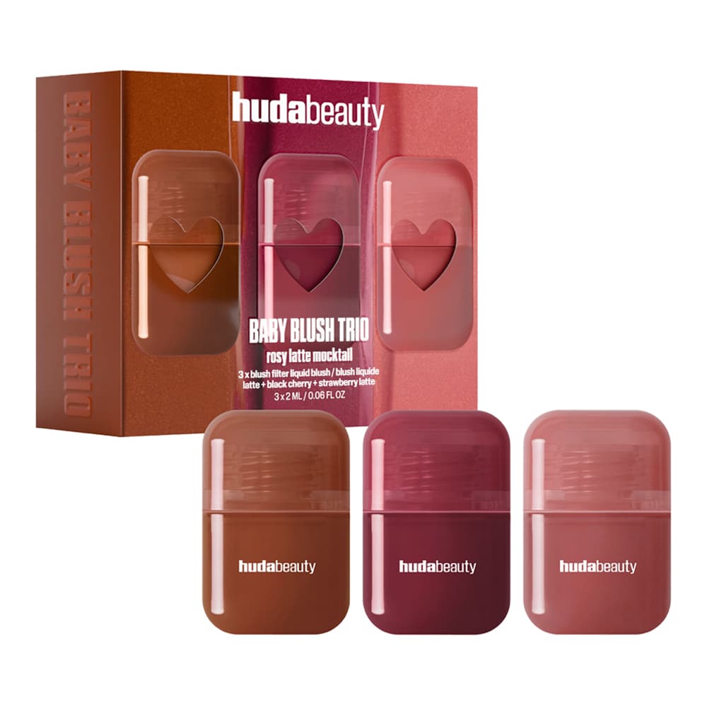Huda Beauty Baby Blush Trio box with heart cutouts beside three mini liquid blushes in brown, berry and rose pink