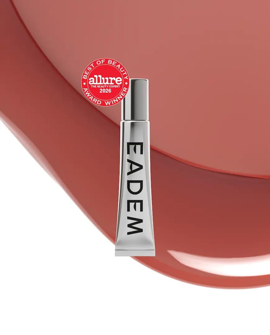 Silver tube with Allure 2026 award seal over a glossy terracotta-red balm swirl