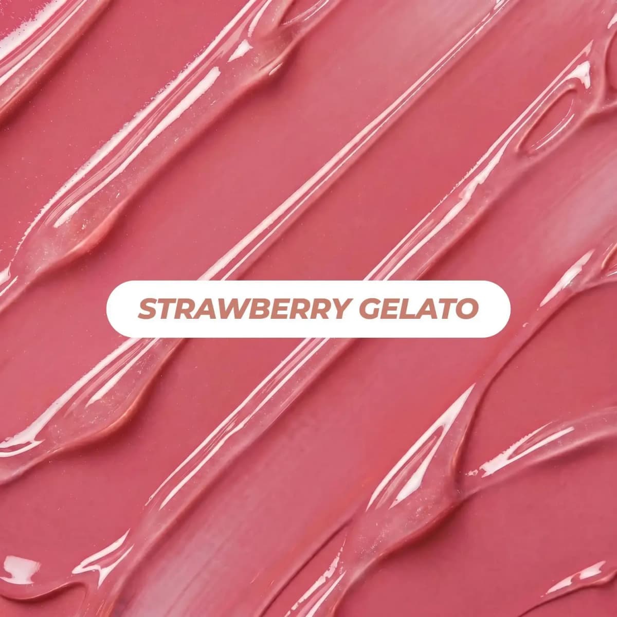 Close-up of glossy sheer pink gel texture swirls with a white label reading Strawberry Gelato in the centre