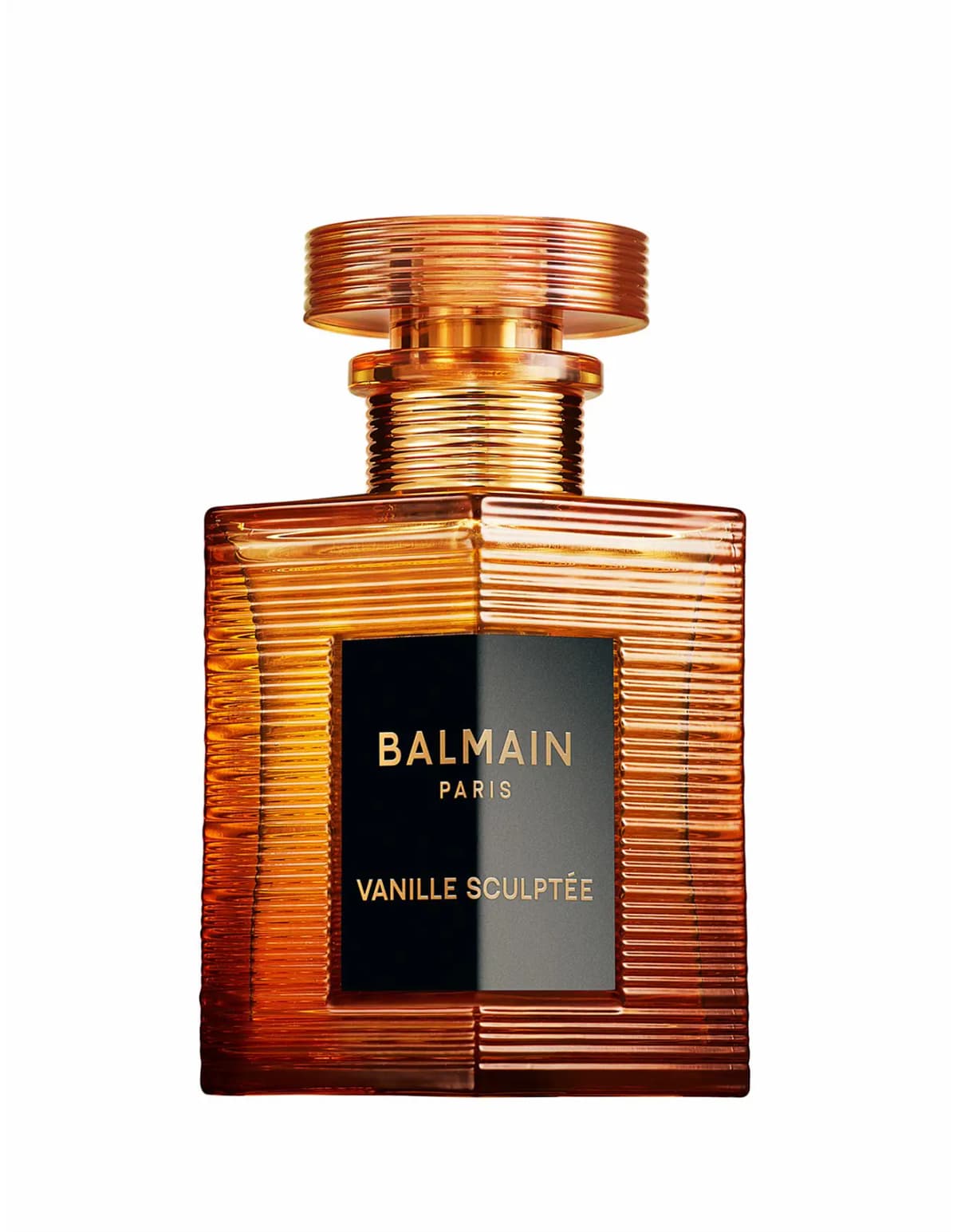 Balmain Vanille Sculptée ribbed amber bottle with black label and gold lettering on a white background