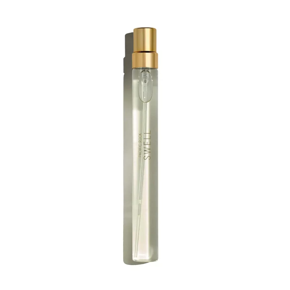 Slim clear Pacific Rock Swell 10ml travel spray with gold-toned cap on a pale background