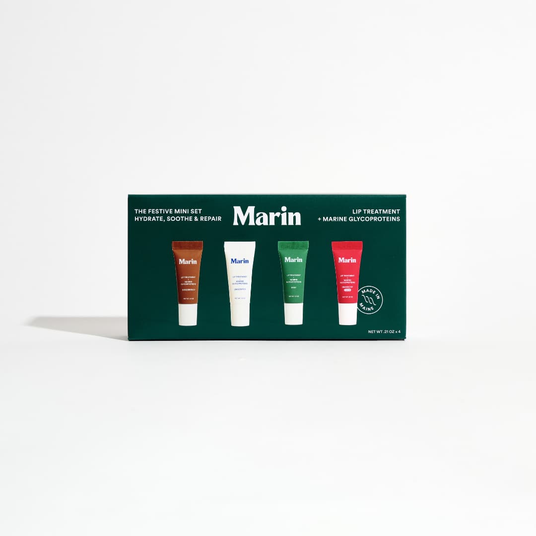 Dark green Festive Mini Set box showing brown, white, green and red mini lip tubes
