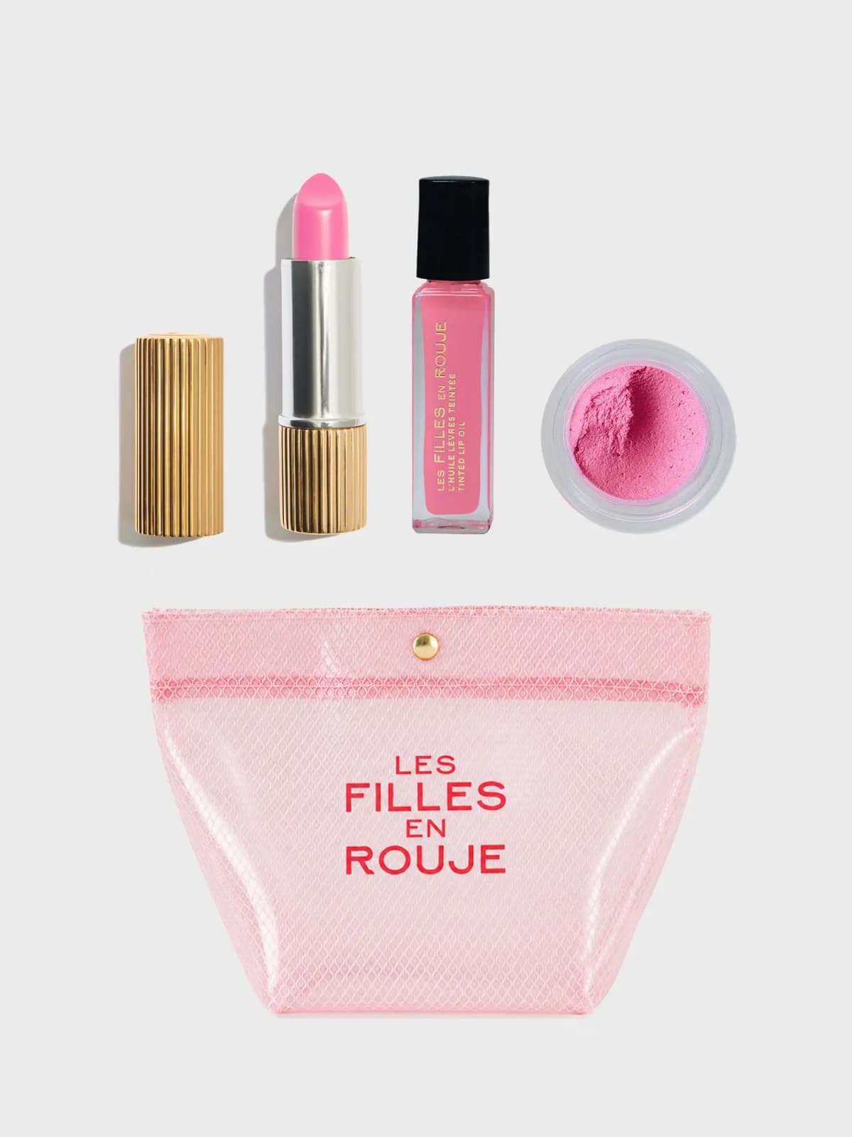 Les Filles en Rouje Full Pink Set: pink balm in a gold ribbed case, lip oil, mousse blush jar and pink mesh pouch