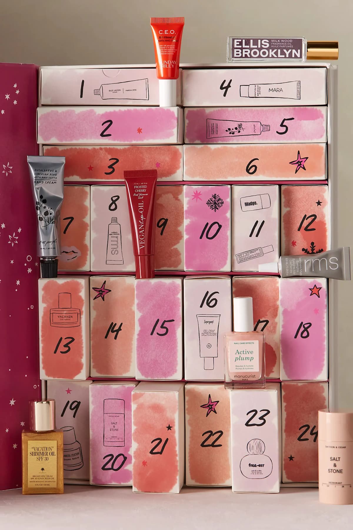 Calendar with products displayed, including Sunday Riley C.E.O. serum, Vegan Lip Oil, rms eyeliner and Salt & Stone deodorant
