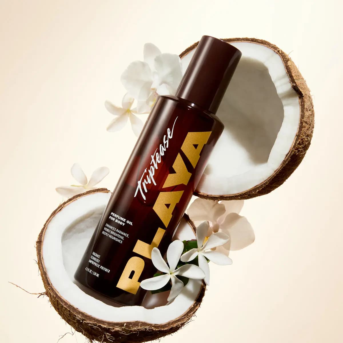 Triptease Perfume Oil for Body bottle floating between two coconut halves surrounded by white orchids and jasmine