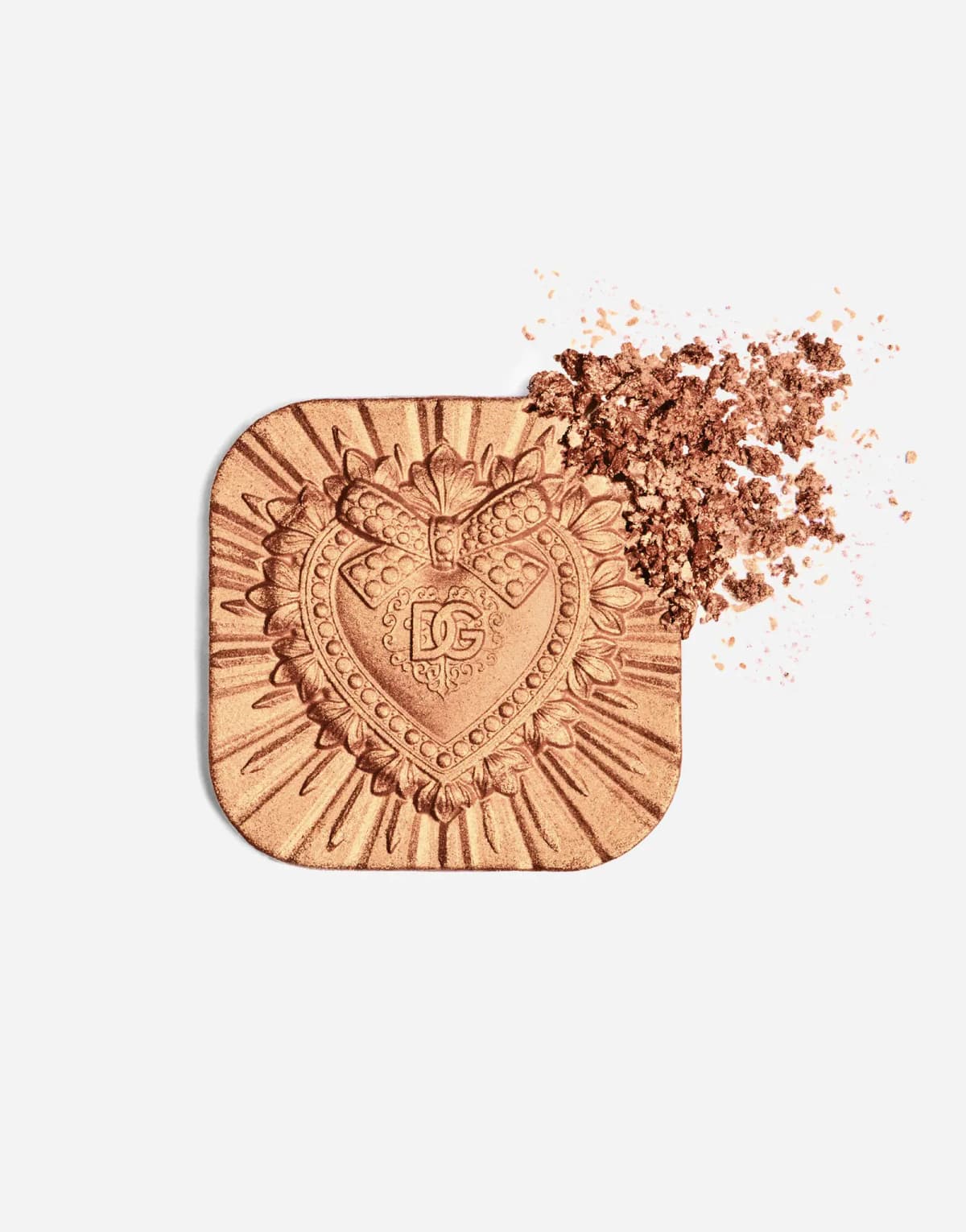 Bronze highlighter pan with an embossed DG heart, crushed into copper-gold shimmer at one corner
