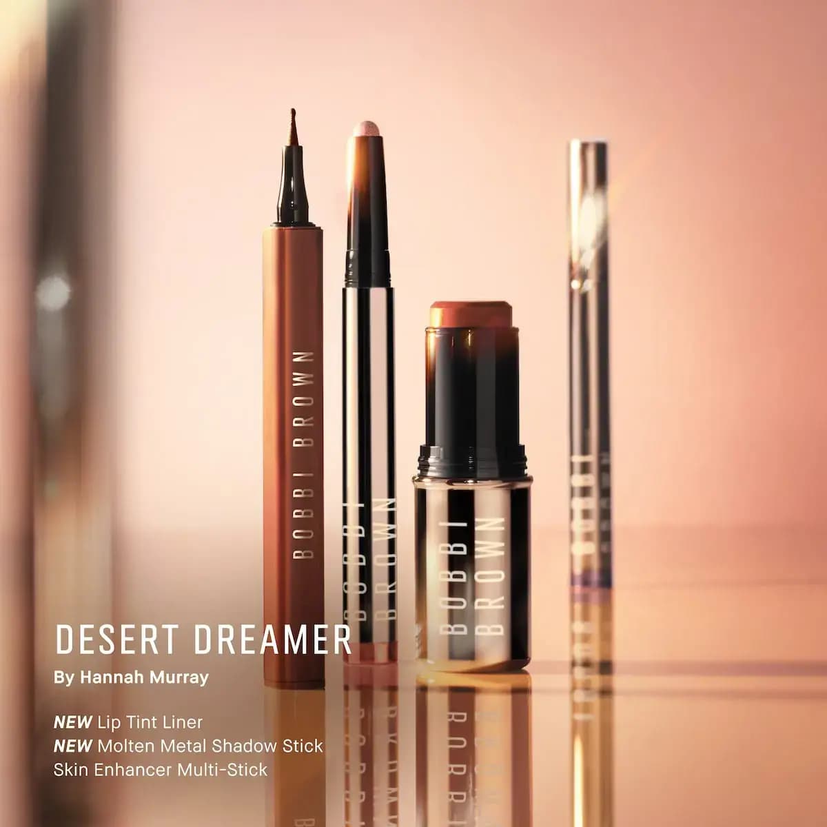 Bobbi Brown Lip Tint Liner, Molten Metal Shadow Stick and Skin Enhancer Multi-Stick on a glossy peach surface.
