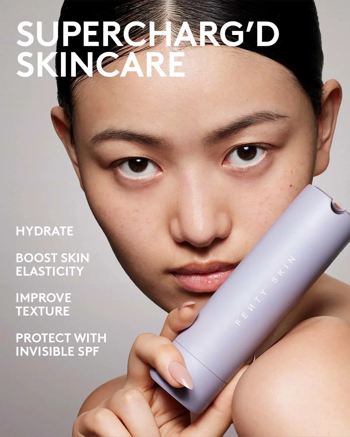 Model holding lavender Fenty Skin tube with text listing hydrate, boost elasticity, texture and SPF benefits