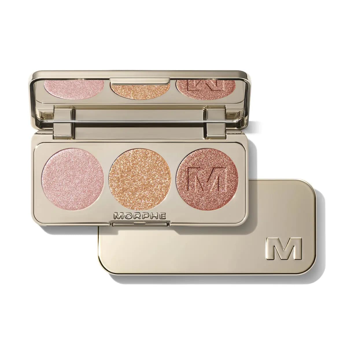 Gold Morphe eyeshadow trio with shimmering pink, sparkly gold and rose copper shades next to its M-logo lid