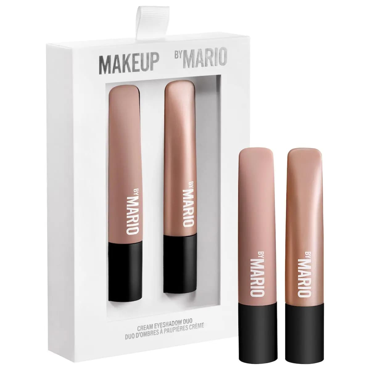 Makeup By Mario Cream Eyeshadow Duo with nude matte and rose gold shimmer stick applicators shown beside white boxed set.