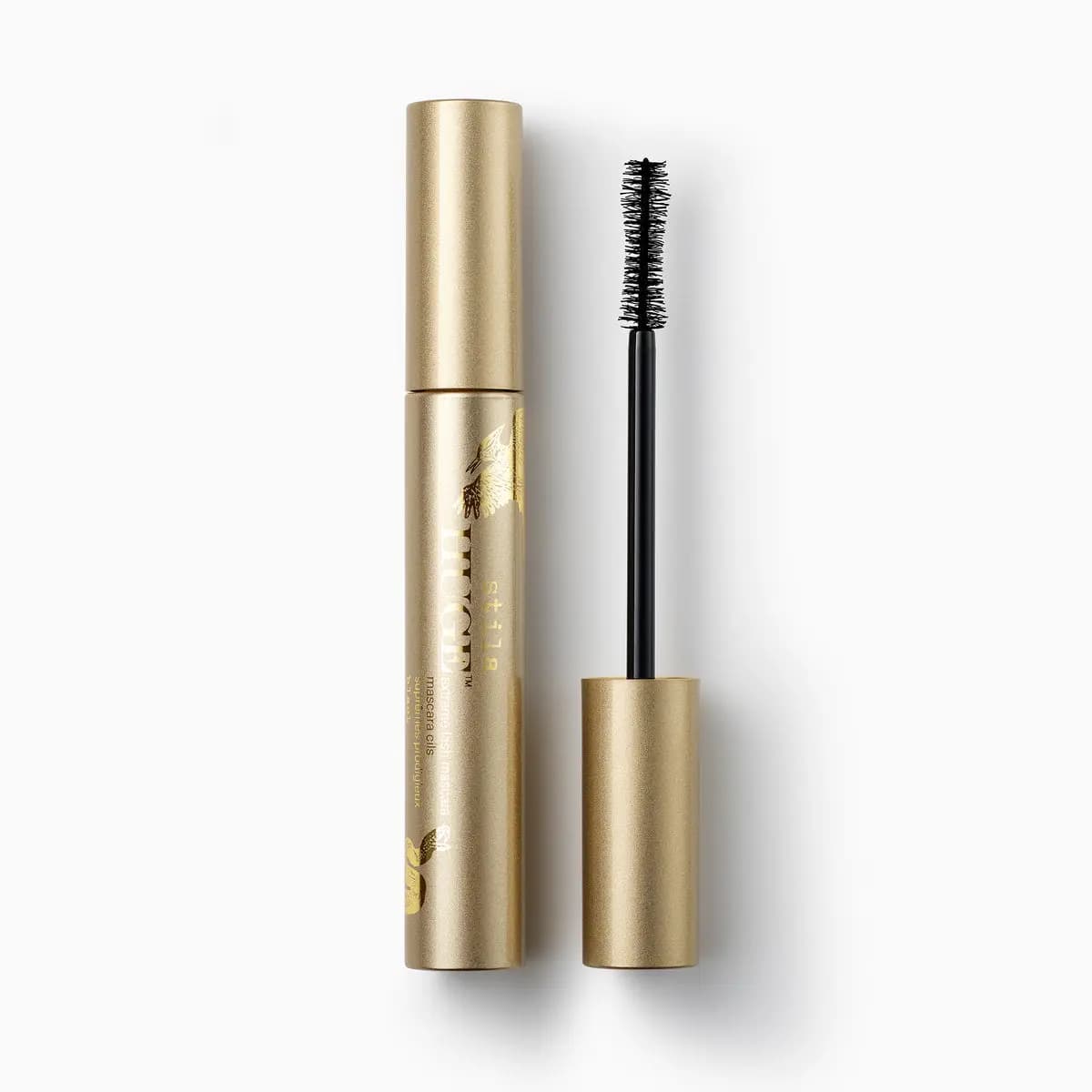 HUGE extreme lash mascara in a gold tube printed with a bird and snake, shown with its black bristle wand