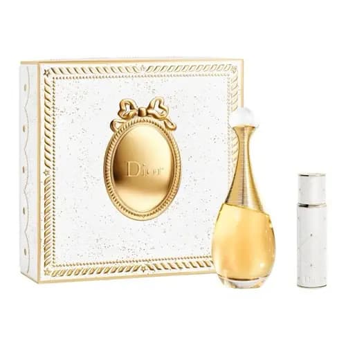 White and gold cameo box with bow beside a gold J'adore perfume bottle and white travel atomiser