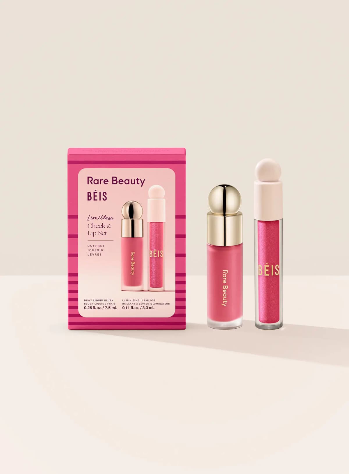 Limitless Cheek & Lip Set box beside the Rare Beauty liquid blush with gold cap and BÉIS shimmer lip gloss