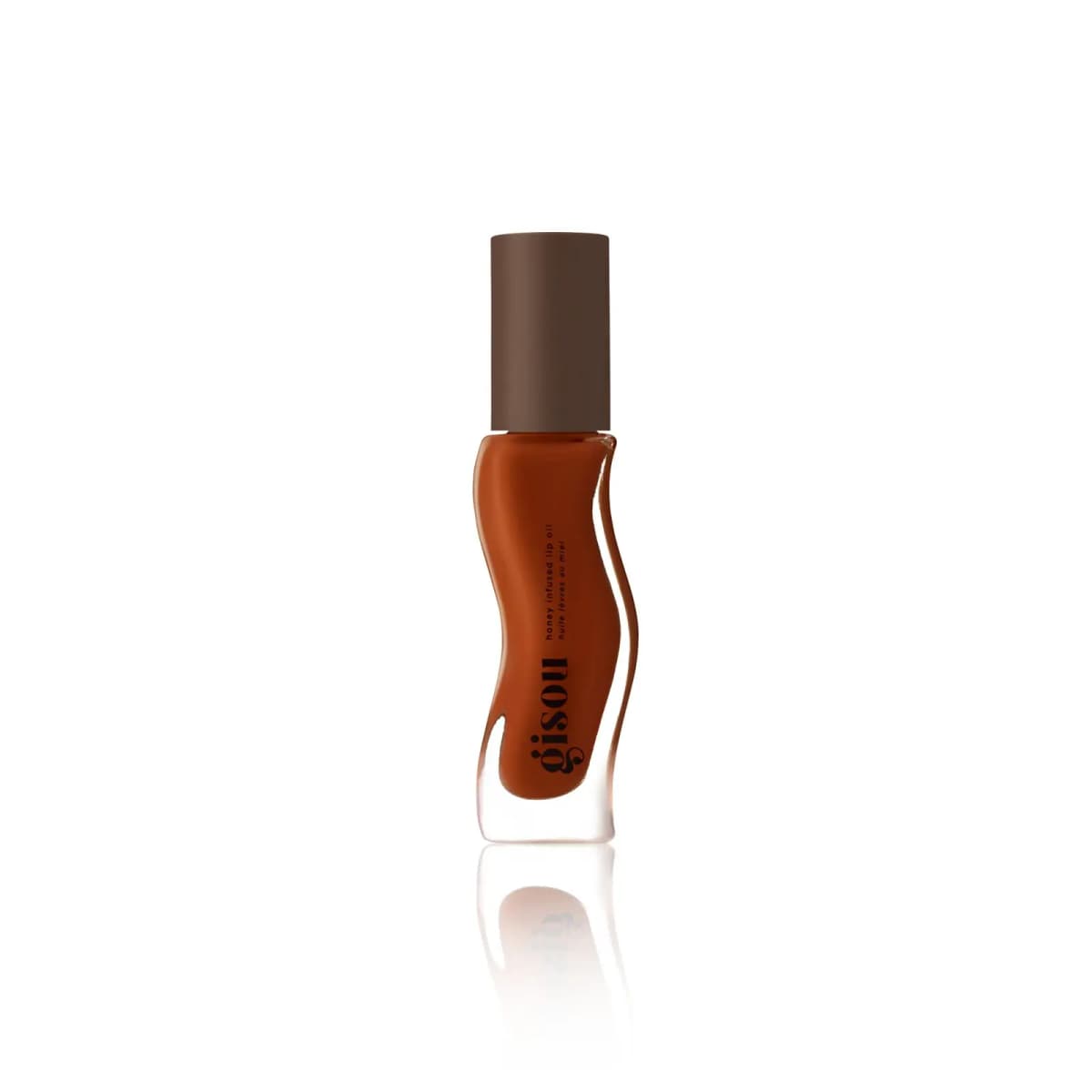Single rust-red wavy Gisou honey infused lip oil bottle with brown cap reflected on a white background
