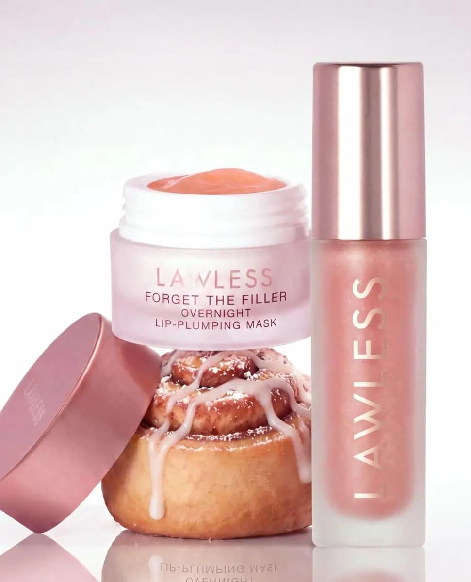 Lawless Forget The Filler Overnight Lip-Plumping Mask and lip gloss beside a frosted cinnamon roll