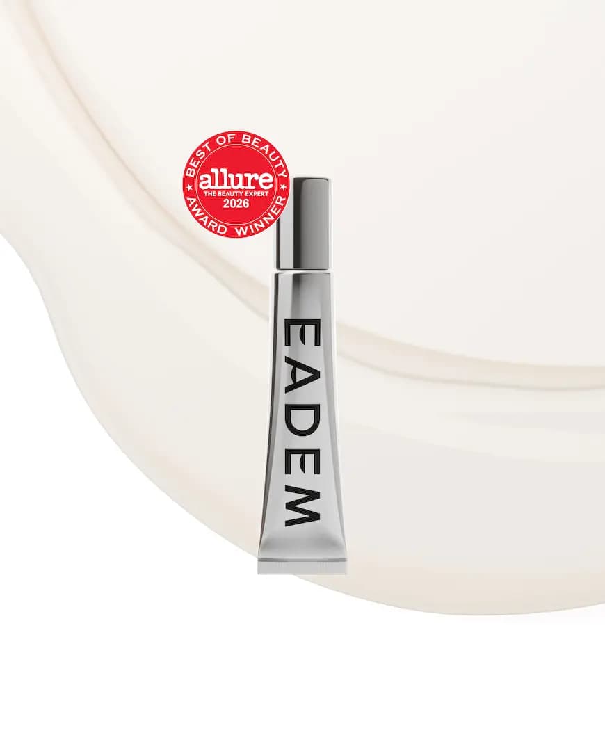 Silver tube with Allure 2026 award badge set against a creamy off-white balm smear