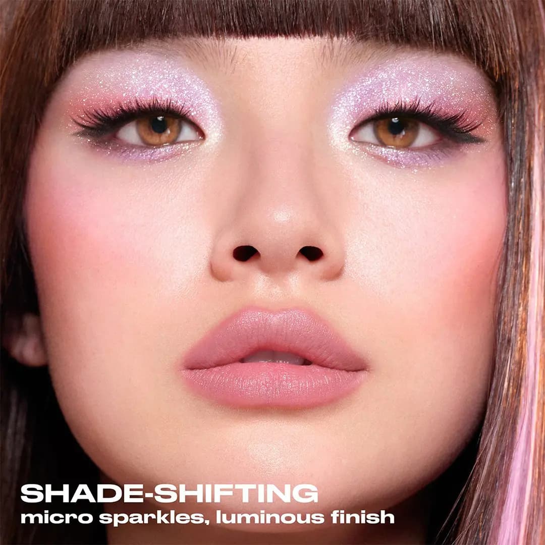 Model wearing Urban Decay Moondust shimmer eyeshadow with shade-shifting micro sparkles, official image