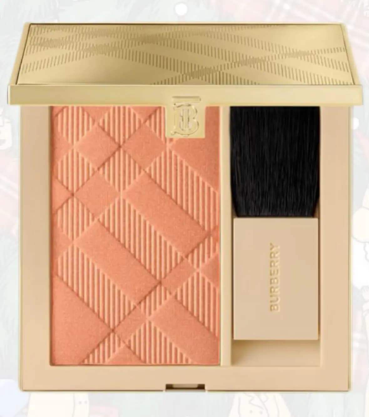Burberry No. 62 Winter Rose blush, a check-embossed peach pan with a black brush in a gold-lidded compact