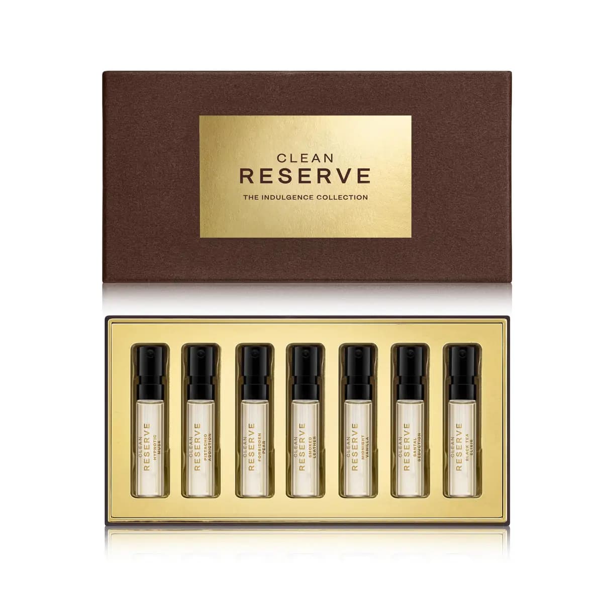Brown gift box with gold Clean Reserve Indulgence Collection label above an open tray holding seven upright fragrance vials.