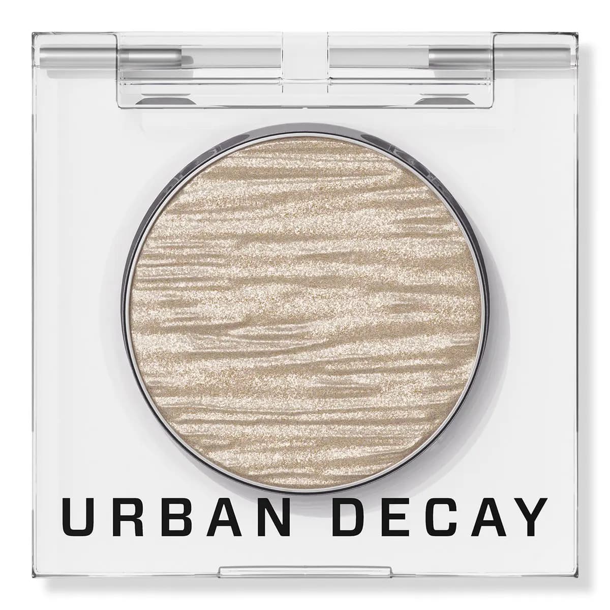 Urban Decay Chrome Melts in Bit Moody, a rippled champagne foil eyeshadow pan in a clear acrylic compact.