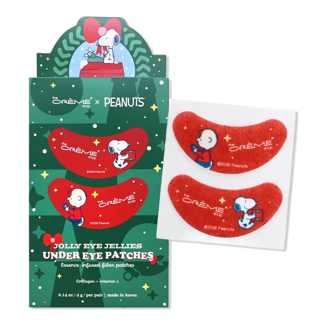 Jolly Eye Jellies Under Eye Patches in green packaging beside a pair of red Charlie Brown and Snoopy patches.