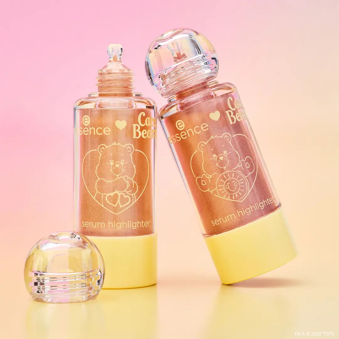 Two serum highlighters in yellow-based bottles with bubble caps and gold Care Bears bear graphics.