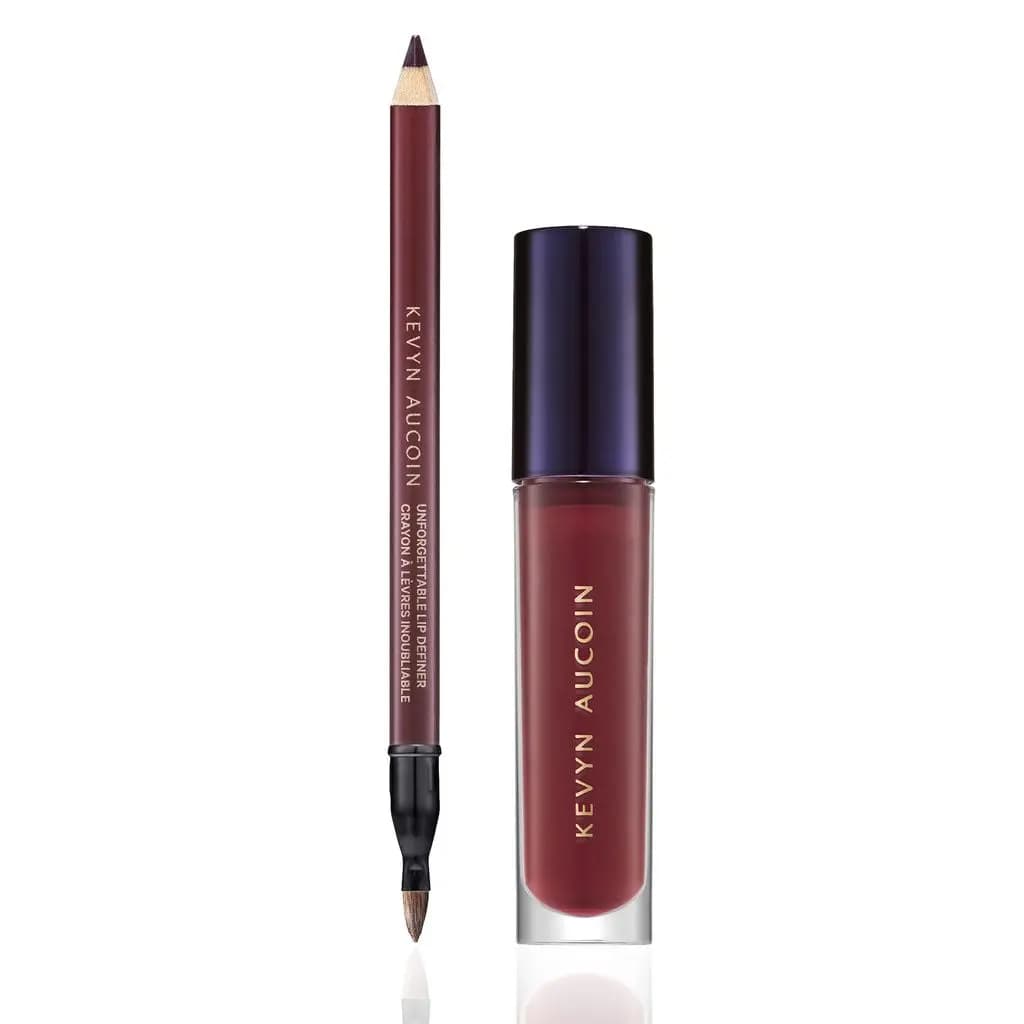Burgundy Unforgettable Lip Definer pencil with brush end beside a deep red Celestial Lip Gloss tube