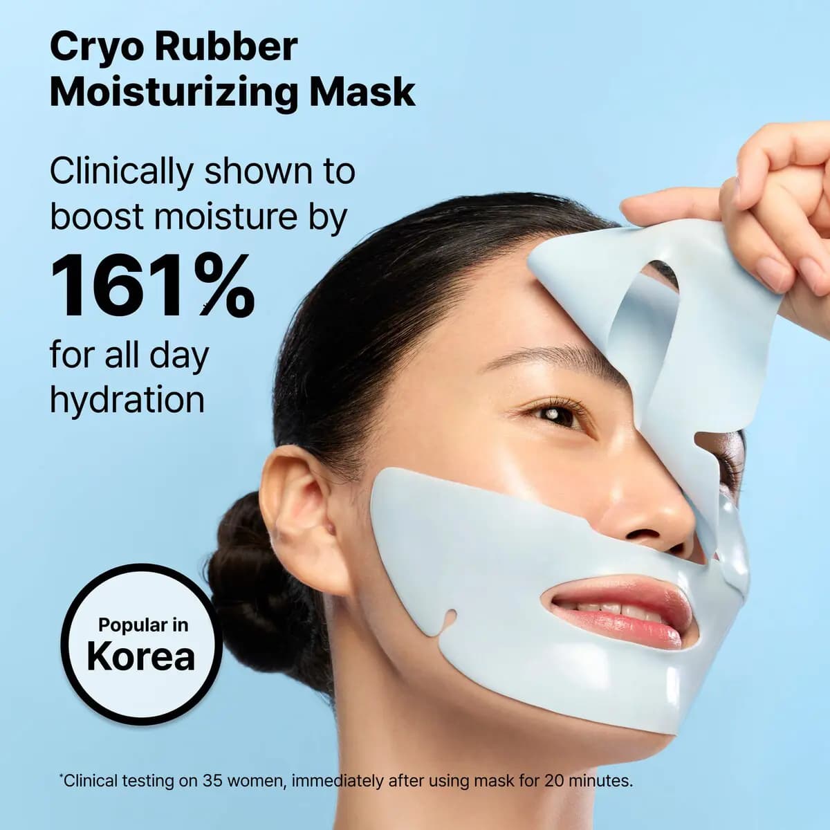 Model lifts a pale blue Cryo Rubber Moisturizing Mask off the face on a light blue backdrop, 161% moisture claim