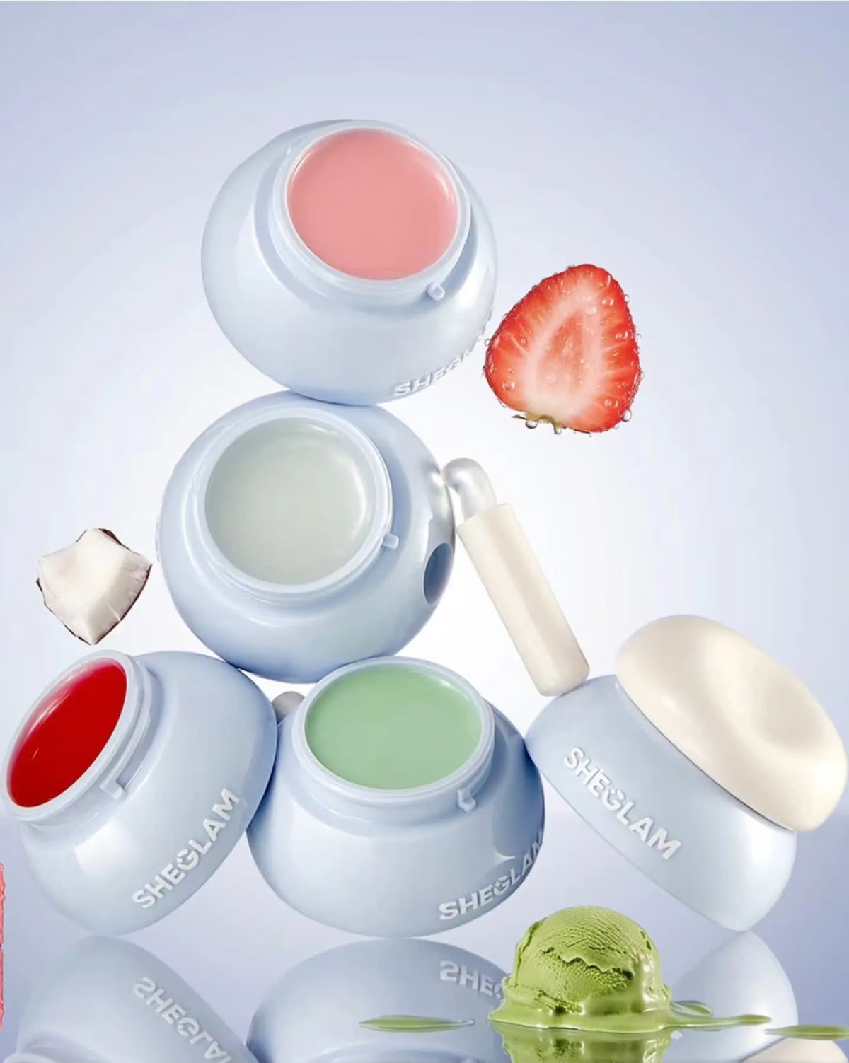 SHEGLAM Jelly Refresh Pocket Lip Mask jars stacked open in pink, clear, red and green with strawberry, coconut