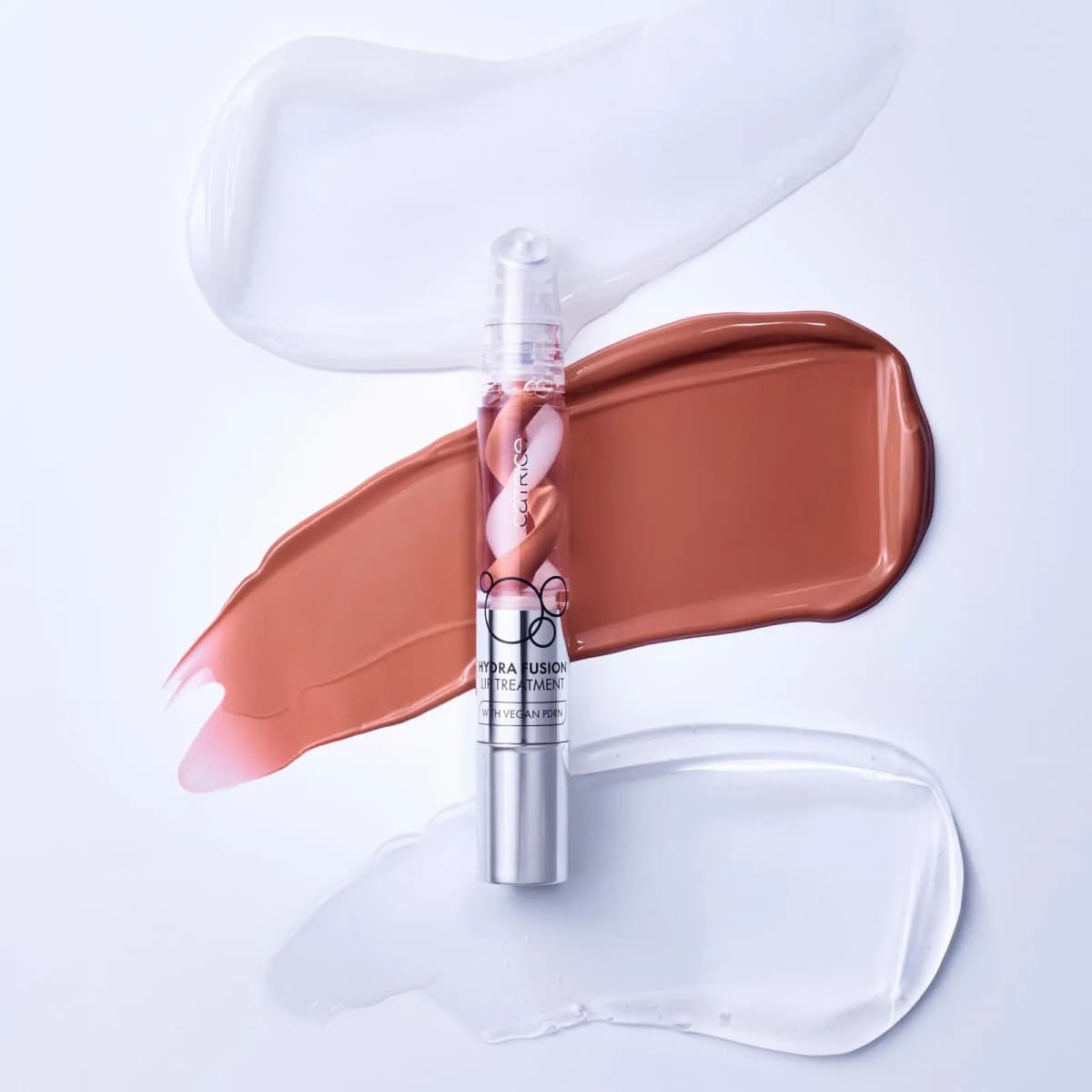 Catrice Hydra Fusion Lip Treatment laid over a terracotta nude swatch between two clear gel smears