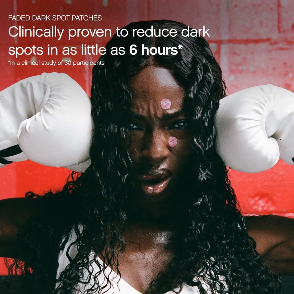 Model in white boxing gloves wearing pink patches on forehead and cheek before a red wall, with a 6-hour patch claim