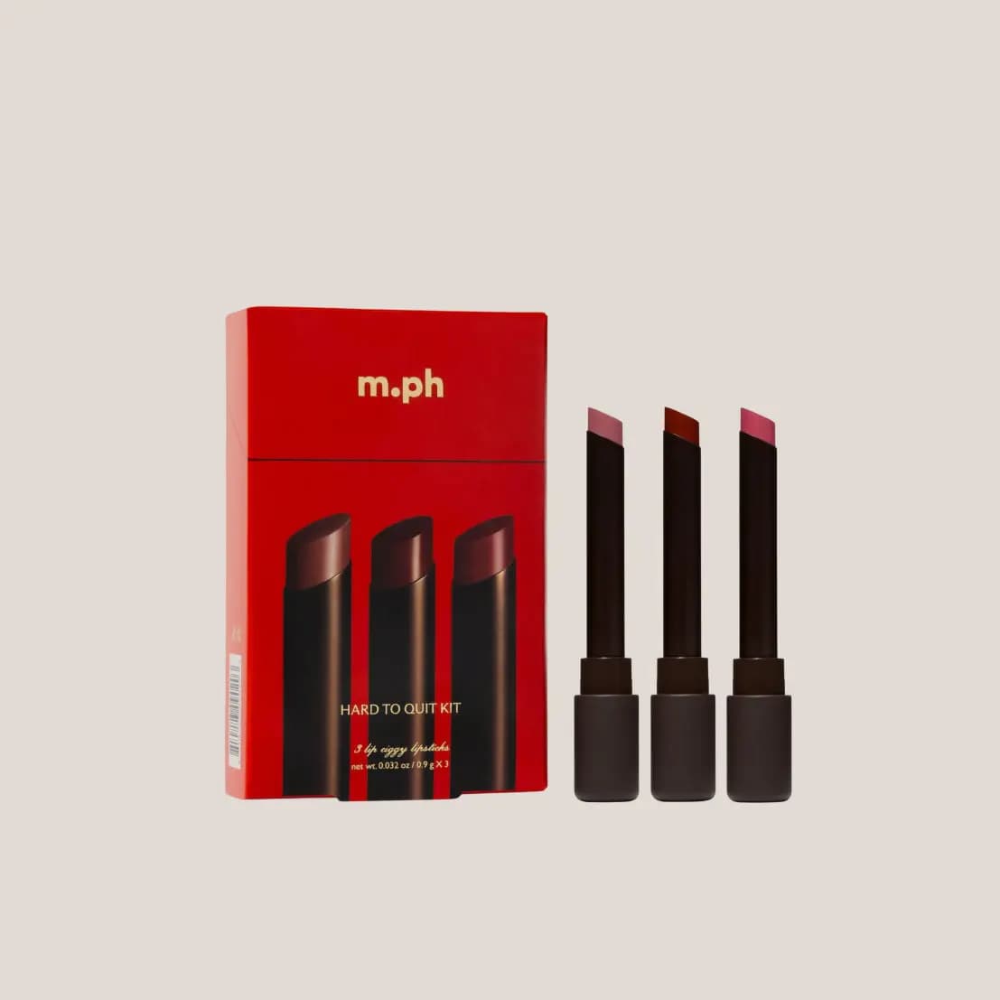 M.ph Hard to Quit Kit red box beside three dark-tubed Lip Ciggy lipsticks in mauve, brick red and berry rose