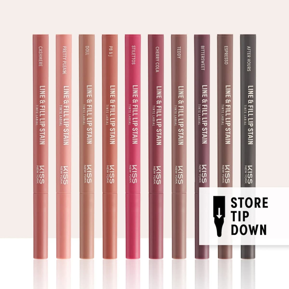 Ten capped Line & Fill Lip Stain pens in nude to black shades standing in a row with a Store Tip Down badge