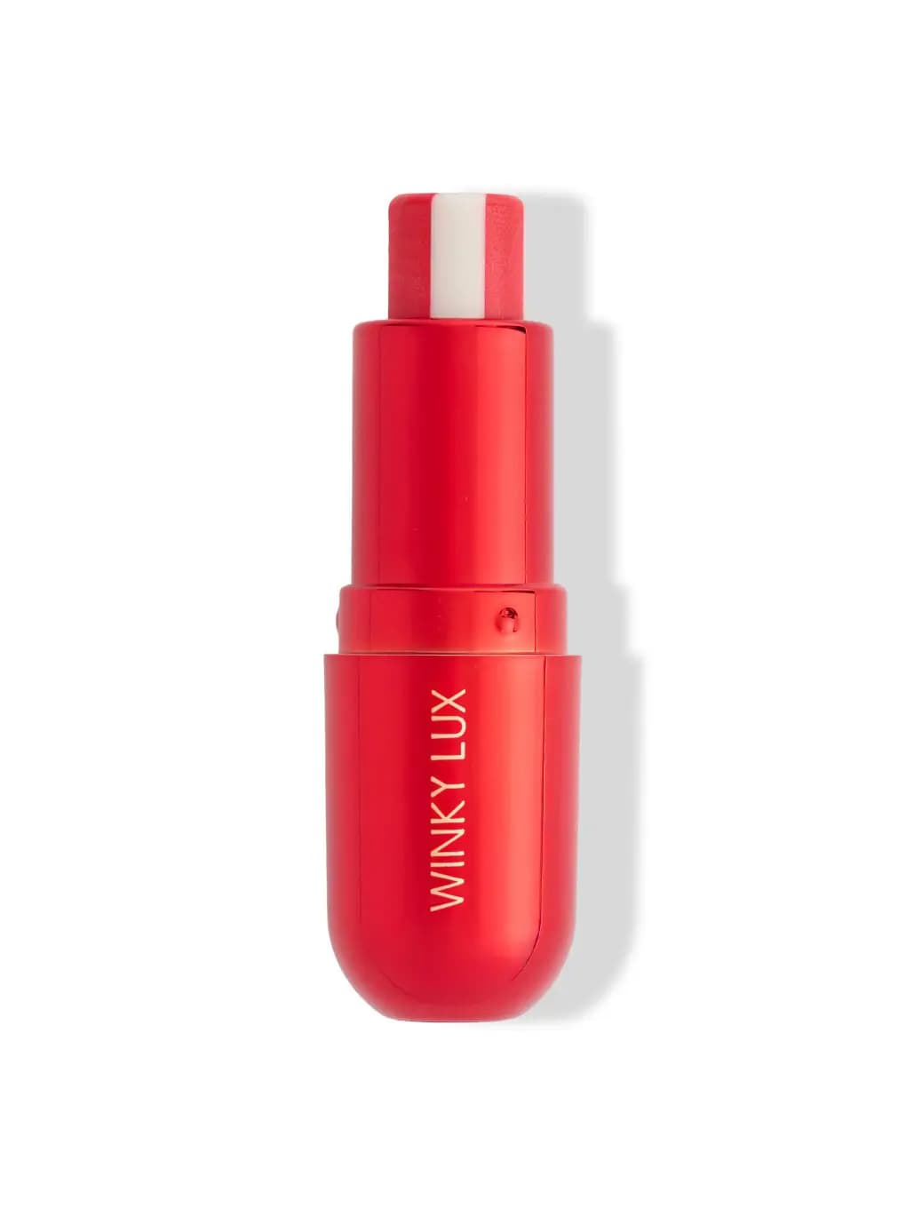 Winky Lux Reindeer Fuel Lip Balm in a glossy red capsule tube with a red-and-white striped balm bullet