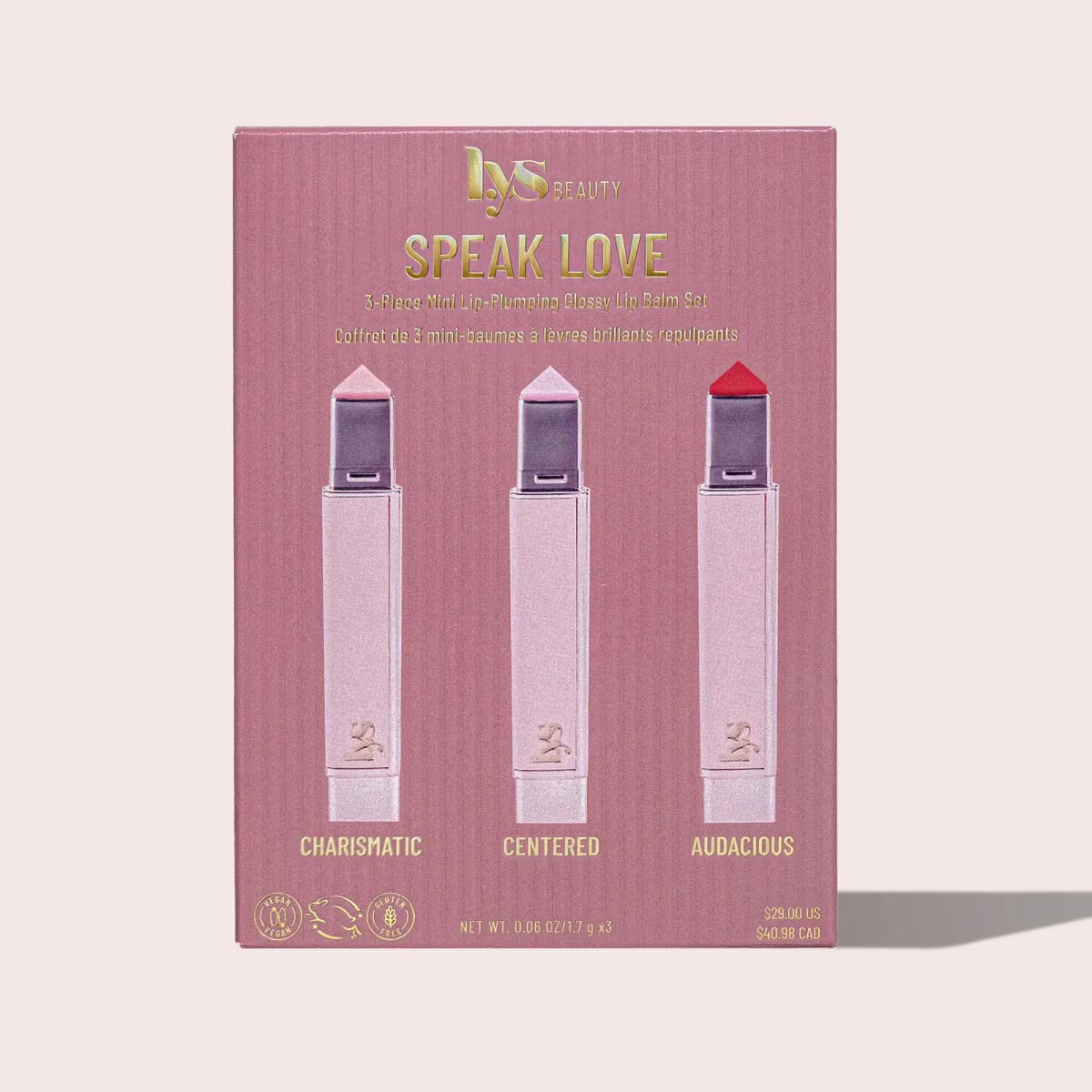Front of the Speak Love box in mauve with gold lettering showing three lip balm minis, priced $29.00 US and $40.98 CAD