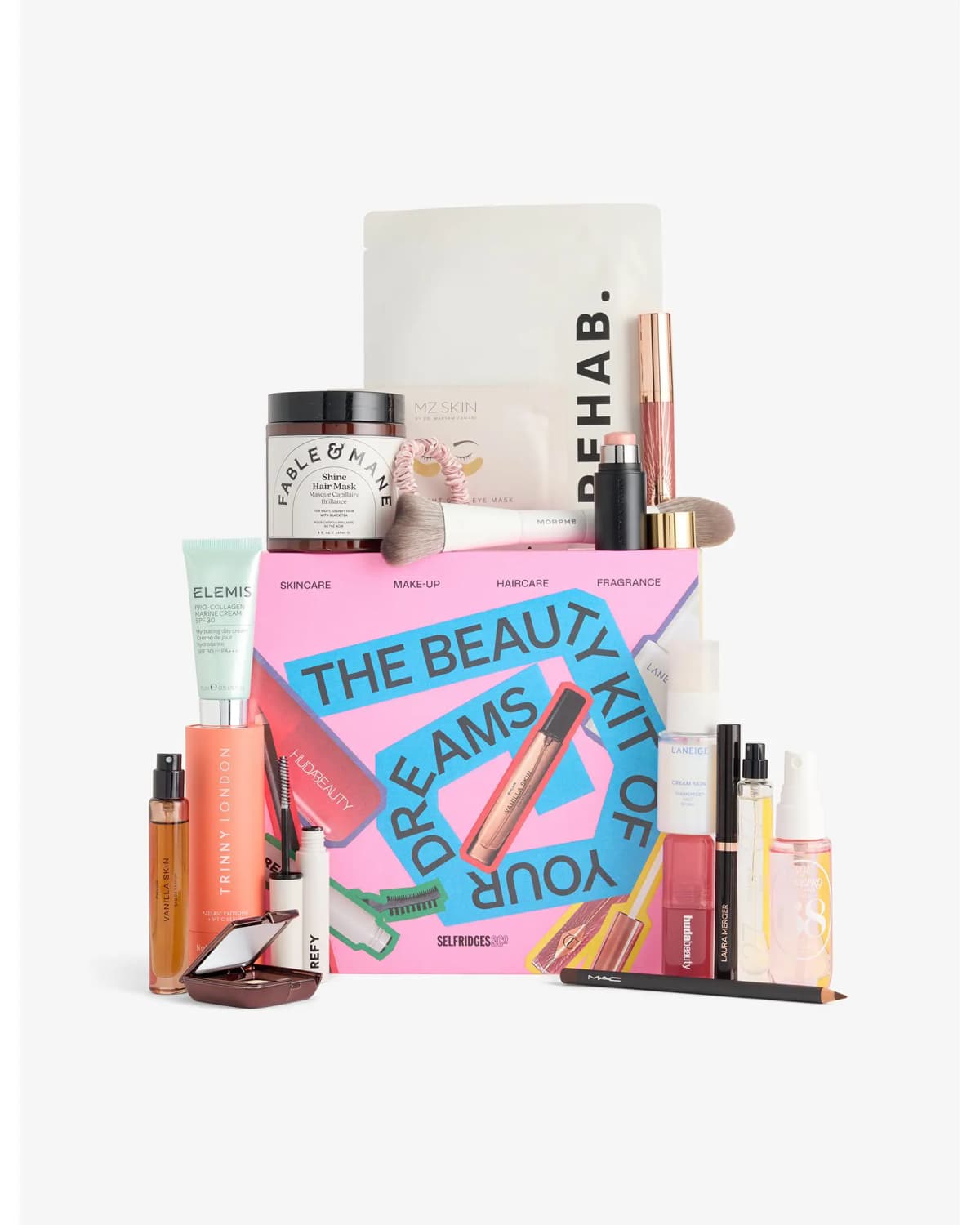 Selfridges Dream Bundle pink box with Elemis, Fable & Mane, Rehab, Morphe, Laneige, MAC and other products arranged around it