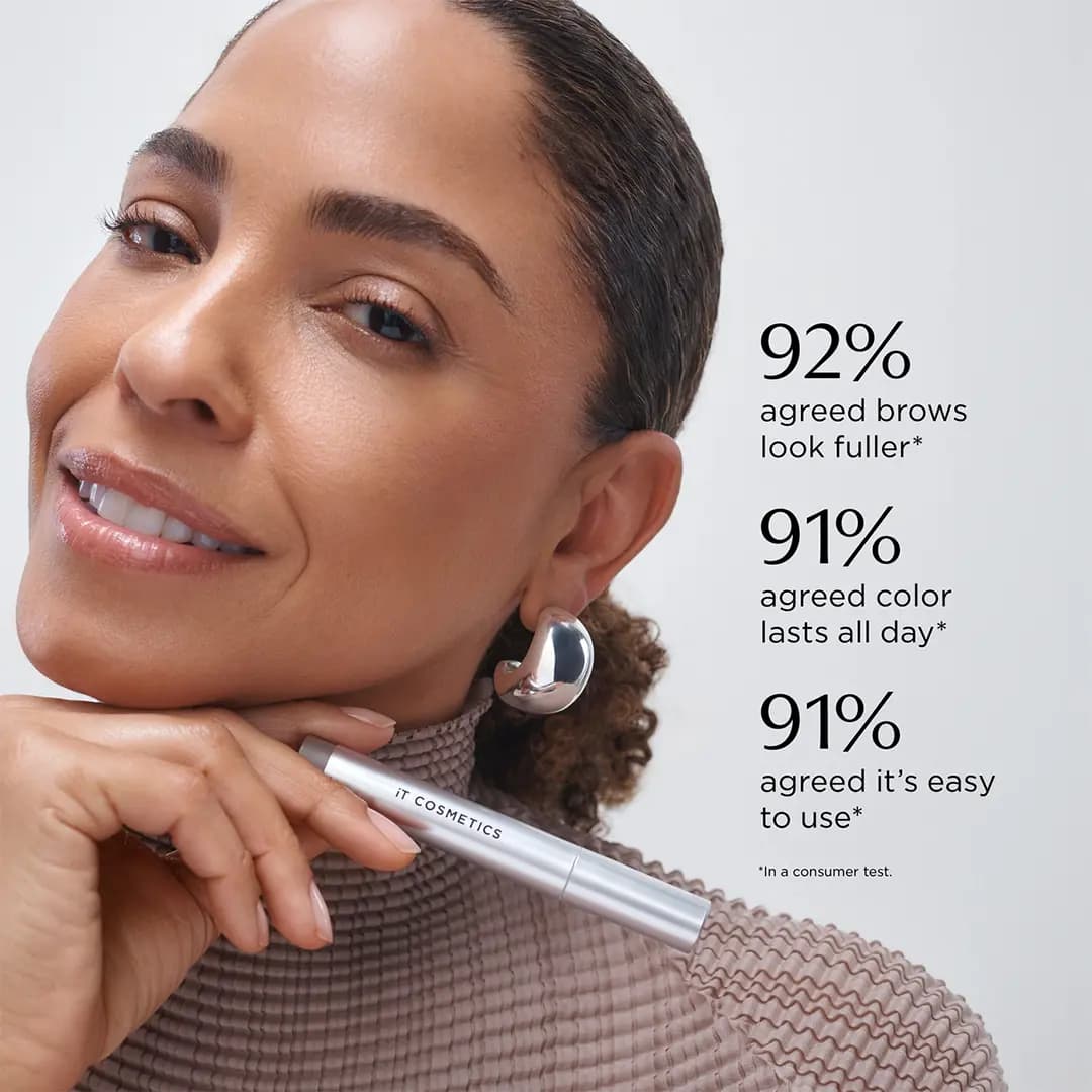 Smiling model with defined dark brows holds a silver IT Cosmetics pen beside consumer test stats of 92% and 91%.