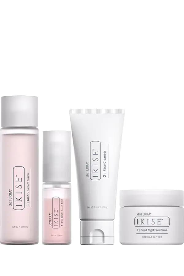 Four-piece set of pink toner, pink dual serum, white face cleanser tube and Day & Night Face Cream jar