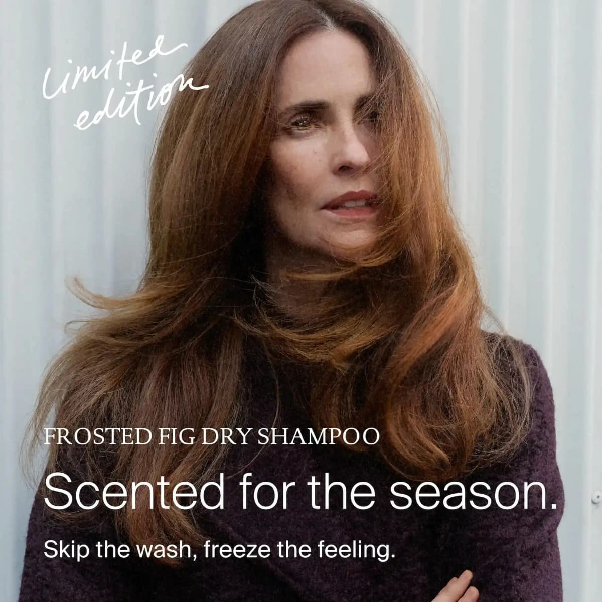 Woman with long, windswept auburn hair in a plum sweater beside "Scented for the season" limited edition text