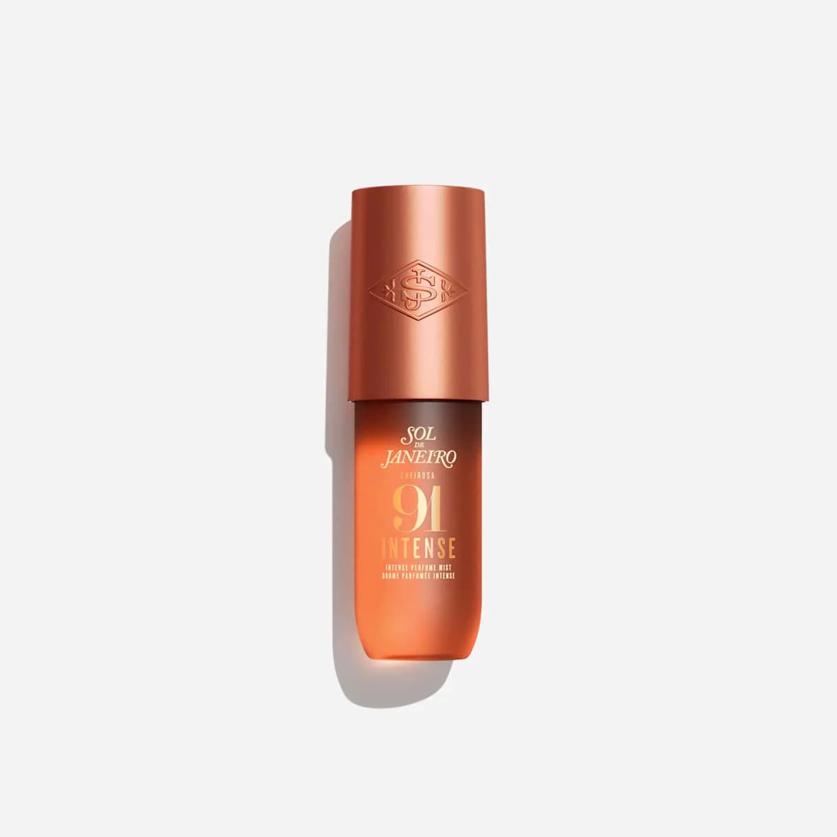 Orange gradient bottle with a copper cap on a plain white background
