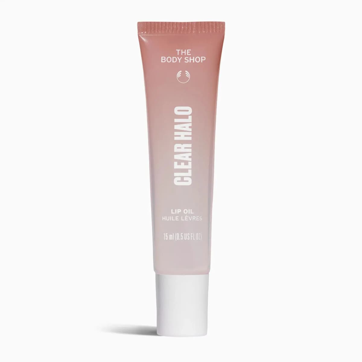 Clear Halo lip oil in a translucent pink gradient tube with white cap