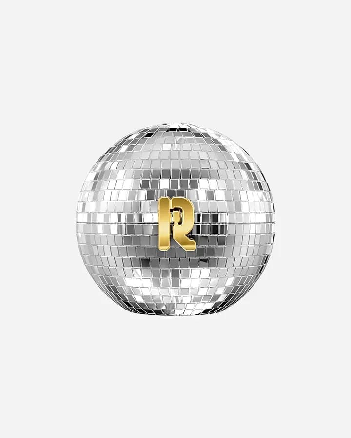 Closed mirrored disco-ball sphere with a gold Rabanne R emblem at its centre, set against a plain background.