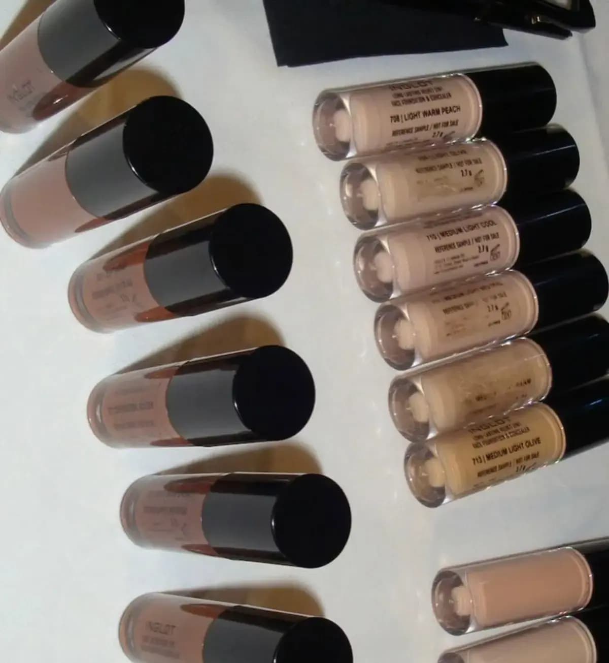 Mini sample vials labelled 708 Light Warm Peach, 713 Medium Light Olive and other light shades