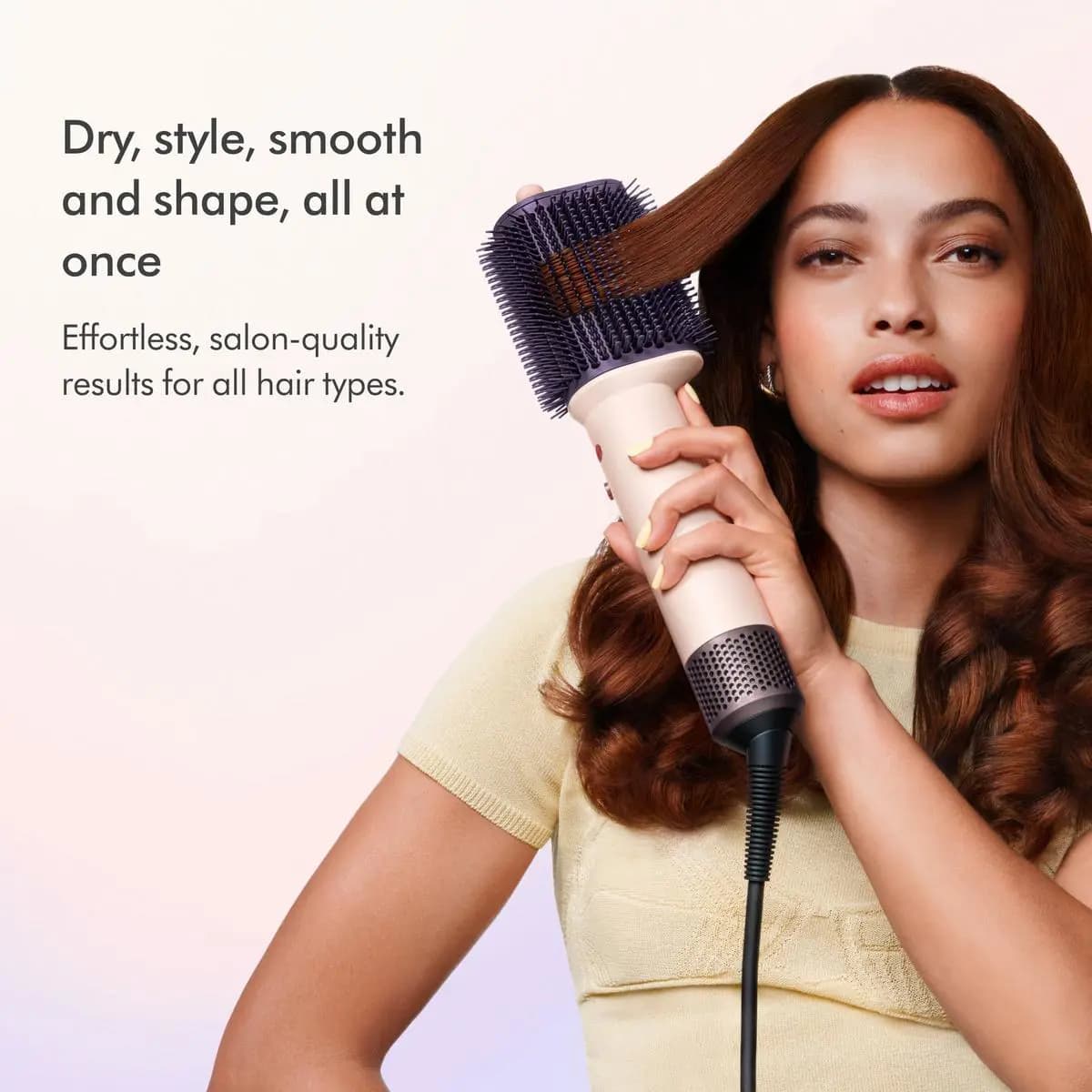 Woman in a yellow top brushes a section of auburn hair upward with the dryer brush, beside text on drying and smoothing