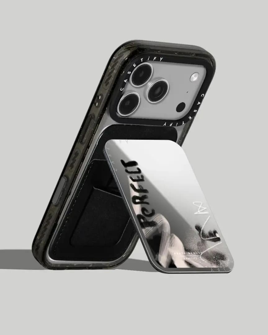 Black phone case with a mirrored "Perfect" cardholder flipped out as a stand